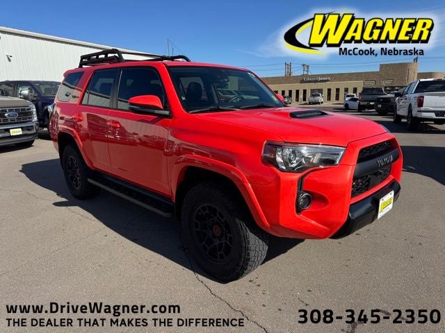 2023 Toyota 4Runner TRD Pro in Solar Octane — front three-quarter view